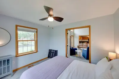 a bedroom with a bed and a ceiling fan at Game Room and Covered Patio Hummelstown Hideaway in Hummelstown