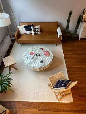 a living room with a couch and a table at Charming Studio West Village in New York