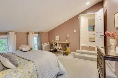 a bedroom with a bed and a desk in it at Upper Black Eddy Home with Delaware River Access! in Upper Black Eddy