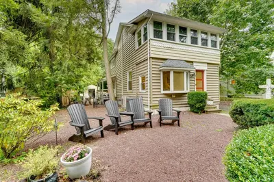a group of chairs sitting in front of a house at Upper Black Eddy Home with Delaware River Access! in Upper Black Eddy