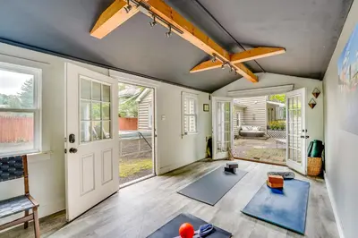 a living room with yoga mats on the floor at Upper Black Eddy Home with Delaware River Access! in Upper Black Eddy