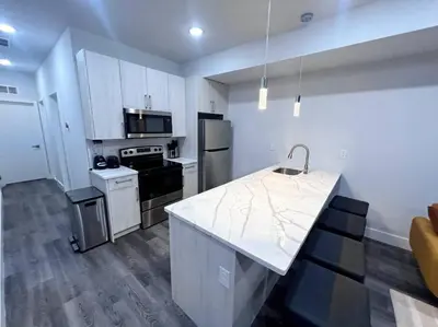 a kitchen with a white counter top in a room at Yanne's Place - Philabundance Views in Philadelphia