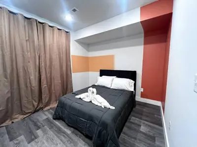 a bedroom with a bed with a stuffed animal on it at Yanne's Place - Philabundance Views in Philadelphia