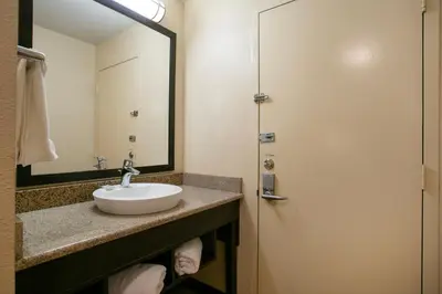 a bathroom with a sink and a mirror at Red Roof Inn Hershey in Hershey
