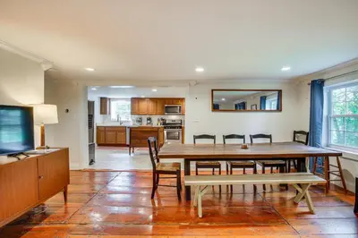 a kitchen and dining room with a table and chairs at Peaceful Upstate New York Home with Yard and Fire Pit! in Walden