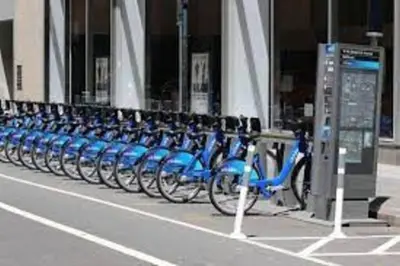 a row of blue bikes parked in front of a building at ✪ Large 2 Bedrooms ✪ Queen Beds ✪ Work Stations in New York