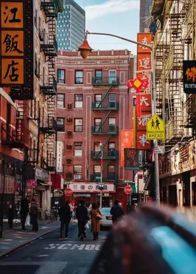 a busy city street with people walking down the street at ✪ Large 2 Bedrooms ✪ Queen Beds ✪ Work Stations in New York