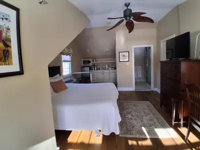a bedroom with a bed and a ceiling fan at Joseph Ambler Inn in North Wales