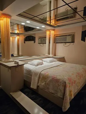 a bedroom with a large bed in a room at Loop Inn Motel in Avenel