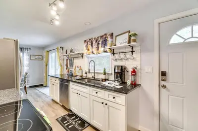a kitchen with a sink and a counter top at 5 Mi to Tobyhanna State Park Home with Game Room! in Tobyhanna