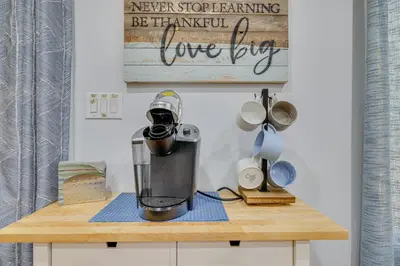 a blender sitting on top of a wooden table at Community Perks Family Poconos Home with Deck! in Tobyhanna