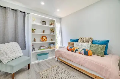 a bedroom with a bed and a chair at Community Perks Family Poconos Home with Deck! in Tobyhanna