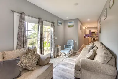 a living room with two couches and a window at Mountville Rental with Private Patio and Gas Grill! in Mountville