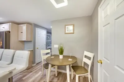 a living room with a table and chairs and a couch at Mountville Rental with Private Patio and Gas Grill! in Mountville