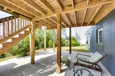 a patio with a wooden pergola and a bench at Mountville Rental with Private Patio and Gas Grill! in Mountville