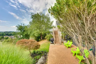 a brick walkway with green chairs and stairs at Mountville Rental with Private Patio and Gas Grill! in Mountville