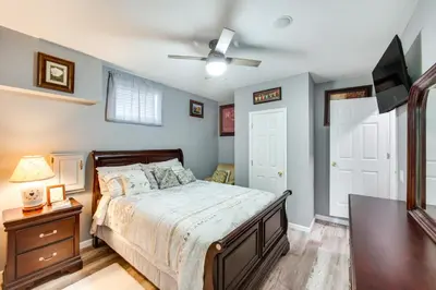 a bedroom with a bed and a ceiling fan at Mountville Rental with Private Patio and Gas Grill! in Mountville