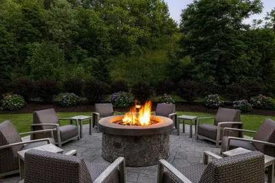 a fire pit in the middle of a patio at Courtyard by Marriott Wilkes-Barre Arena in Wilkes-Barre