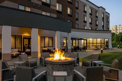 a fire pit in the courtyard of a hotel at Courtyard by Marriott Wilkes-Barre Arena in Wilkes-Barre