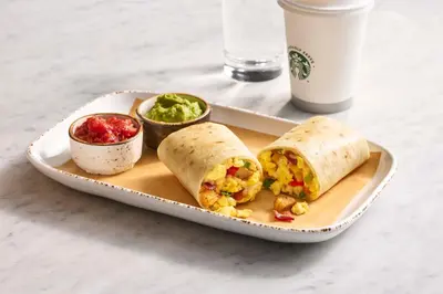 a plate of food with a burrito and a drink at Courtyard by Marriott Wilkes-Barre Arena in Wilkes-Barre