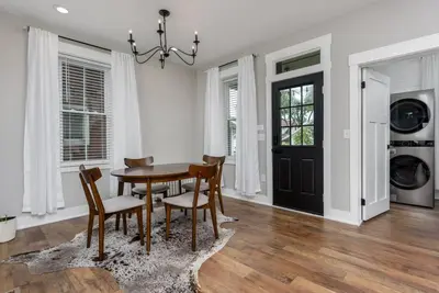 a dining room with a table and chairs at Sunset Stay at 608 in Wormleysburg