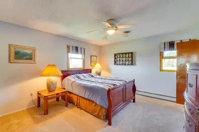 a bedroom with a bed and a ceiling fan at Muncy Vacation Rental with Deck and Views in Muncy