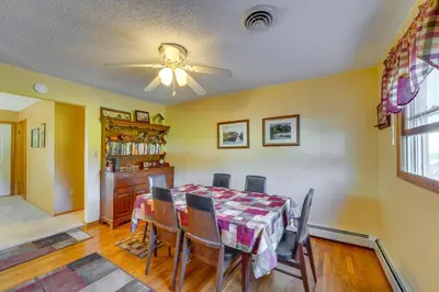 a dining room with a table and chairs and a ceiling fan at Muncy Vacation Rental with Deck and Views in Muncy