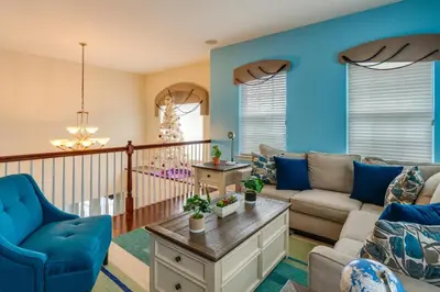 a living room with blue walls at Centrally Located Family Home with Pool in Harleysville