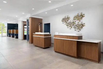 a lobby with a heart art on the wall at Courtyard by Marriott New Castle in New Castle