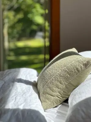 a pillow sitting on top of a bed at Campbell Estates in Franklin