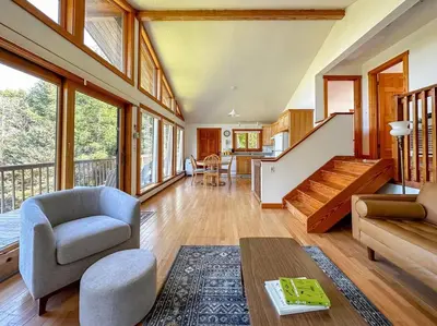a living room with a couch chair and a table at Campbell Estates in Franklin