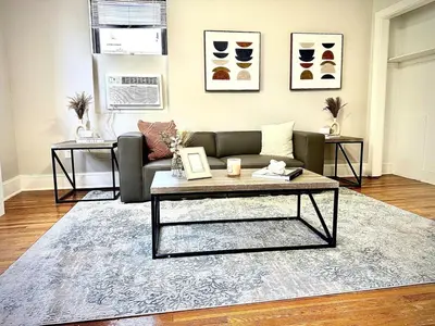a living room with a couch and a coffee table at Lennox C407 Cozy and Spacious Studio1br Apt in Philadelphia