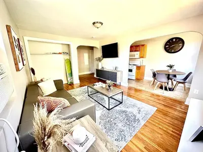 a living room with a couch and a table at Lennox C407 Cozy and Spacious Studio1br Apt in Philadelphia