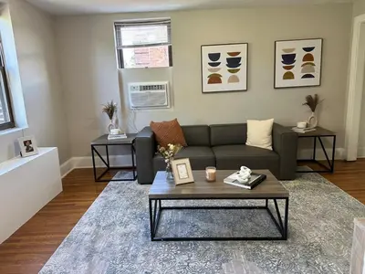 a living room with a couch and a coffee table at Lennox C407 Cozy and Spacious Studio1br Apt in Philadelphia