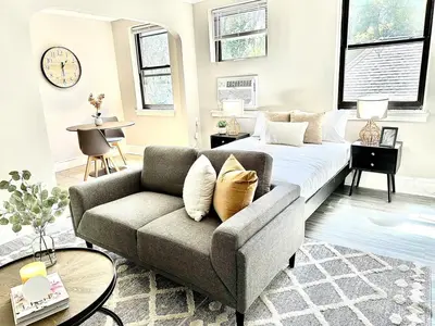 a living room with a couch and a bed at Lennox C405 Peaceful & Perfect Studio Apt in Philadelphia