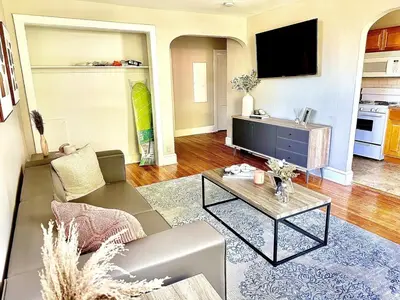 a living room with a couch and a tv at Lennox C303 Peaceful, Perfect Private Studio1br in Philadelphia
