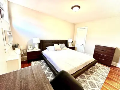 a bedroom with a bed and a table at Lennox C303 Peaceful, Perfect Private Studio1br in Philadelphia