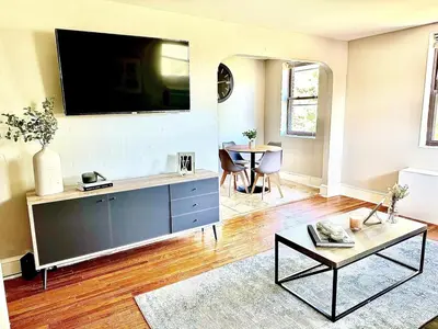 a living room with a tv on a wall at Lennox C304 Peaceful & Perfect Private 1-br in Philadelphia