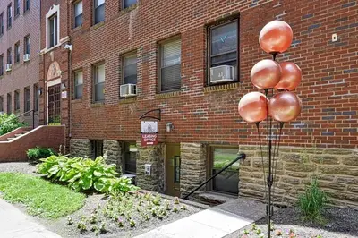a metal pole in front of a brick building at Lennox C302 Peaceful & Perfect Private 1Br in Philadelphia