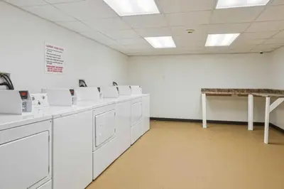 a large room with white washing machines in it at Lennox C302 Peaceful & Perfect Private 1Br in Philadelphia