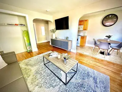 a living room with a coffee table and a dining room at Lennox C409 Peaceful & Perfect Private 1-Br in Philadelphia