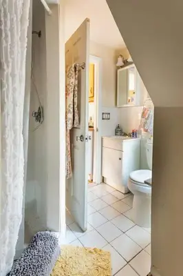 a white bathroom with a toilet and a sink at Large Space Great for Groups & Families in Montclair