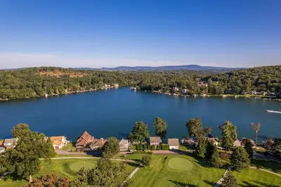 an aerial view of a home on a lake at Lakefront Home at Lake Winola, PA in Factoryville