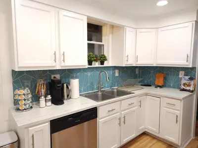 a kitchen with white cabinets and a sink at Bethlehem Bliss:10min to Valley Festivals & Events in Bethlehem