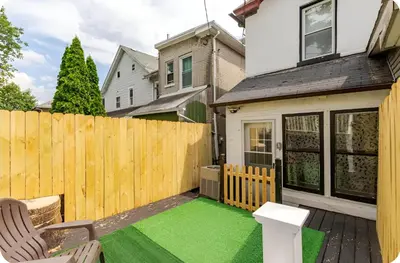 a backyard with a wooden fence and a green lawn at Bethlehem Bliss:10min to Valley Festivals & Events in Bethlehem