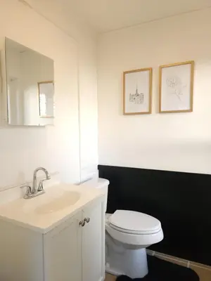 a bathroom with a white toilet and a sink at Bethlehem Bliss:10min to Valley Festivals & Events in Bethlehem