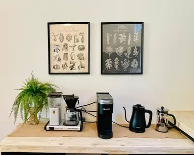 a counter with a coffee maker and a blender on it at The Stone Mason - Large Modern Home on 5 Acres - 2 Hrs from NYC in Pond Eddy