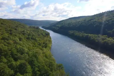 an aerial view of a river in a valley at The Stone Mason - Large Modern Home on 5 Acres - 2 Hrs from NYC in Pond Eddy