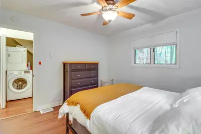 a bedroom with a bed and a ceiling fan at Deck, Fire Pit and Pool Access Pennsylvania Home! in Albrightsville