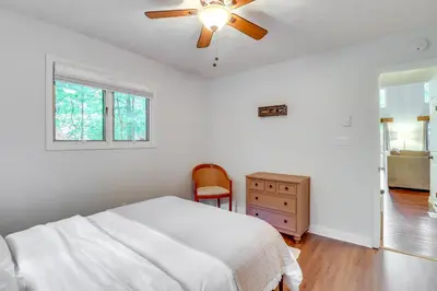 a bedroom with a bed and a ceiling fan at Deck, Fire Pit and Pool Access Pennsylvania Home! in Albrightsville